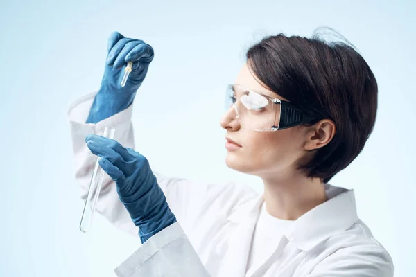 Laboratory assistant sitting at the table microscope research biotechnology isolated background — Stock Photo, Image