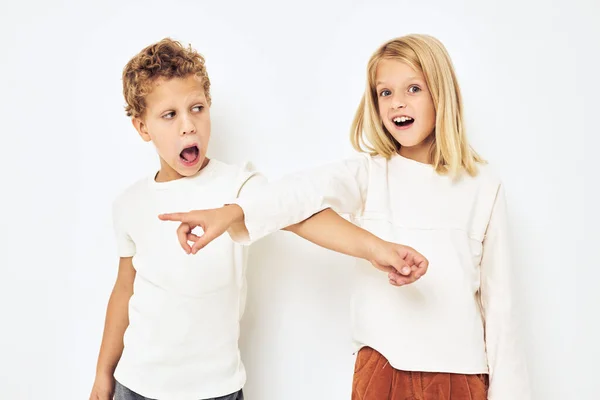 Cheerful children dance smile posing casual wear light background — Stock Photo, Image