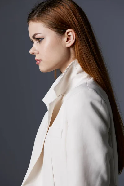 Young woman luxury model in white coat unaltered — Stockfoto