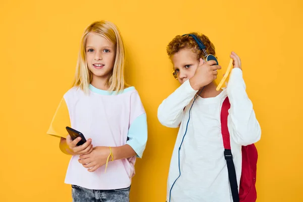 Cute kids use gadgets with headphones Studio education concept — Foto Stock
