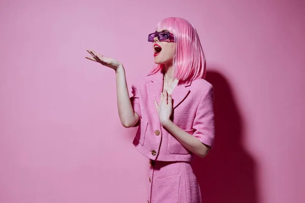 Portrait of a young woman gestures with his hands with a pink jacket Studio Model unaltered — Zdjęcie stockowe