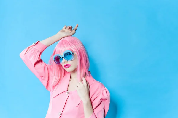 Woman fashion blue glasses makeup fashion blue background — Stock Fotó