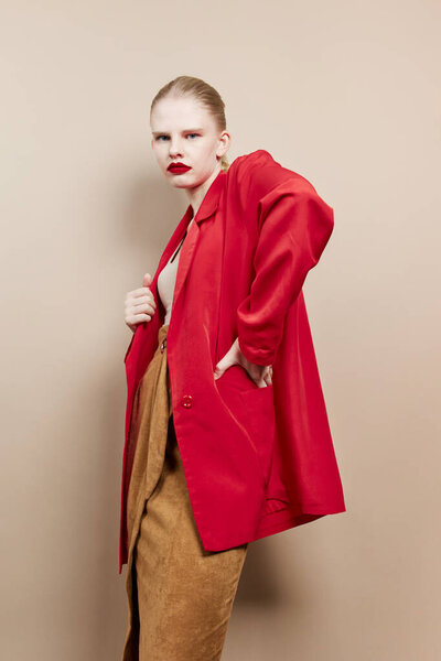 portrait of a woman makeup in red jacket studio model unaltered
