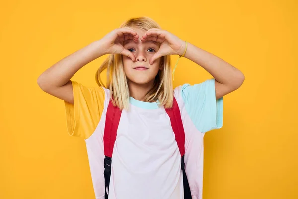 Happy schoolgirl with a red backpack isolated background — Stock Fotó