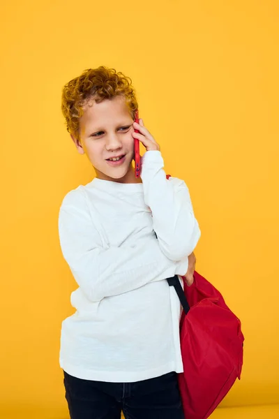 Cheerful young boy use the phone education kids lifestyle isolated background — Fotografia de Stock