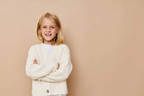 Little cute girl in a white sweater cropped view — Stockfoto
