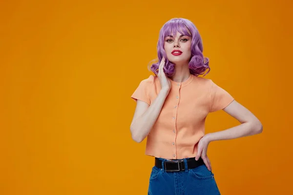 Pretty woman wavy purple hair emotions fun yellow background unaltered — 图库照片