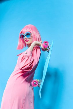 woman fashion blue glasses skateboard isolated background