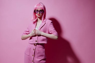 Portrait of a charming lady gesturing with hands pink jacket lifestyle glamor Studio Model unaltered