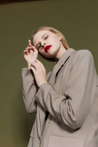 Portrait of a woman with red lips coat bright makeup Lifestyle posing — Fotografia de Stock