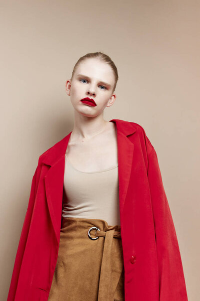 portrait of a woman cosmetics red lips fashion beige background