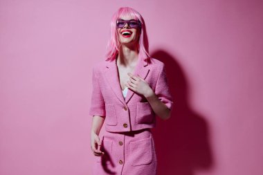 Portrait of a charming lady gesturing with hands pink jacket lifestyle glamor Studio Model unaltered