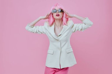 Beautiful fashionable girl in White blazer pink hair Glamor Cosmetics color background unaltered