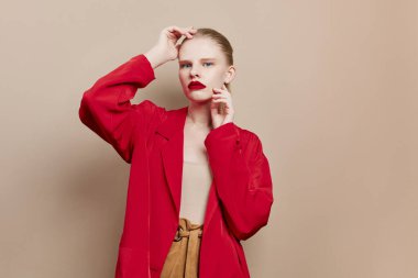 portrait of a woman cosmetics red lips fashion beige background
