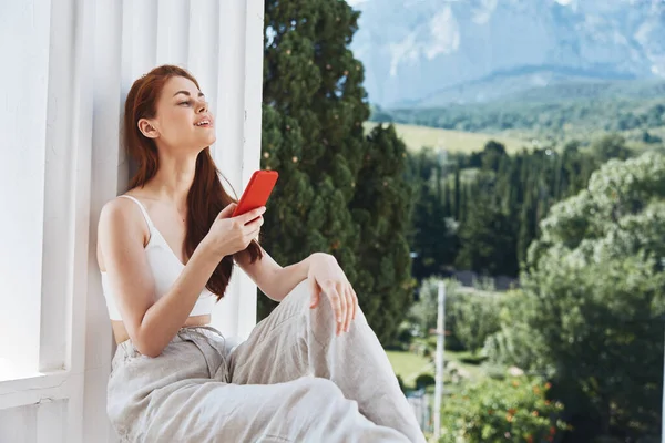 Cheerful Woman Red Phone Terrace High Quality Photo — Fotografia de Stock