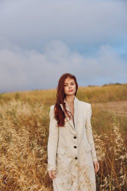 pretty woman walking in the field. High quality photo