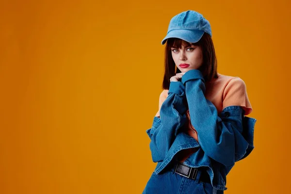 Positive young woman denim cap red lips glamor fashion color background unaltered — Stock Fotó