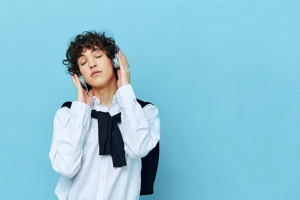 Man technology headphones in a white shirt with sweater isolated backgrounds — Φωτογραφία Αρχείου