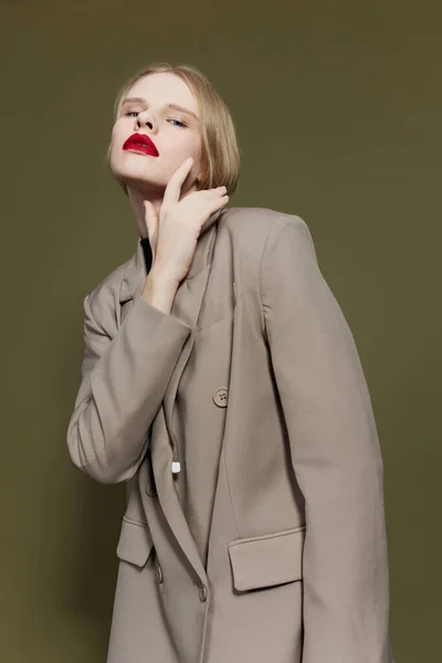 Portrait of a woman in coat red lips fashion isolated background — Foto Stock