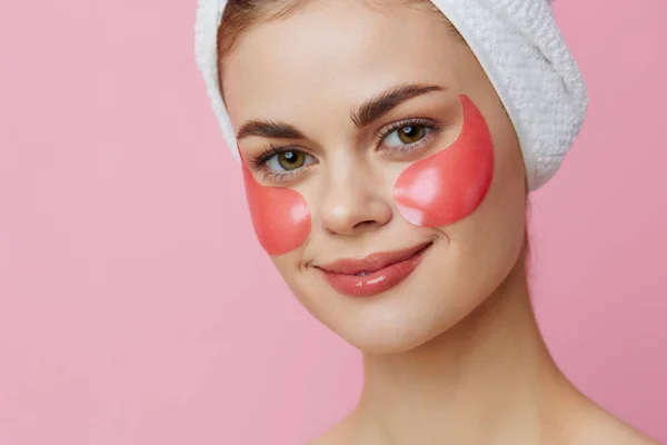 Woman skin care face patches bare shoulders pink background — Stock Photo, Image