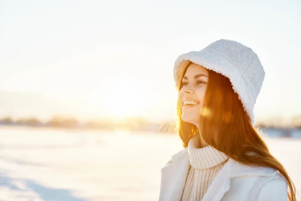 young woman red hair snow field winter clothes Sunny winter day Fresh air