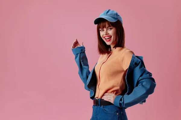Portrait of a charming lady denim cap red lips glamor fashion color background unaltered — Stockfoto