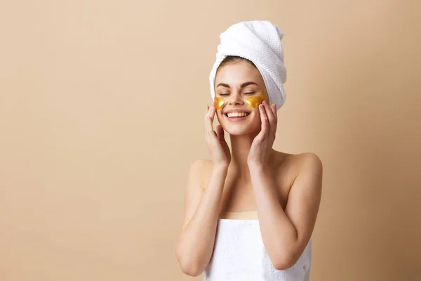 Pretty woman patches rejuvenation skin care fun after shower isolated background — Stock Photo, Image