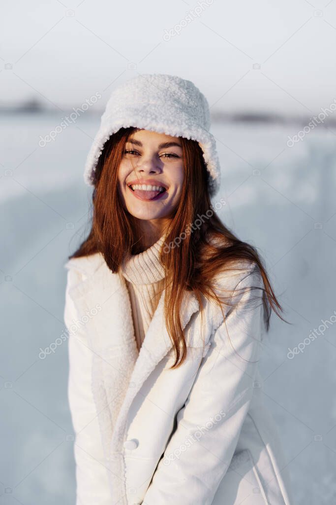 young woman red hair snow field winter clothes nature