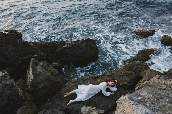 Attractive Woman Long Hair Long White Dress Lying Rocky Cliff — Stock Photo, Image