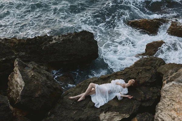 Attractive Woman Long Hair Lies Back Stone Cliff — Stock Photo, Image