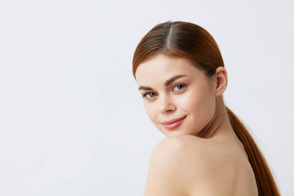 young woman bare shoulders pure skin glamor isolated background