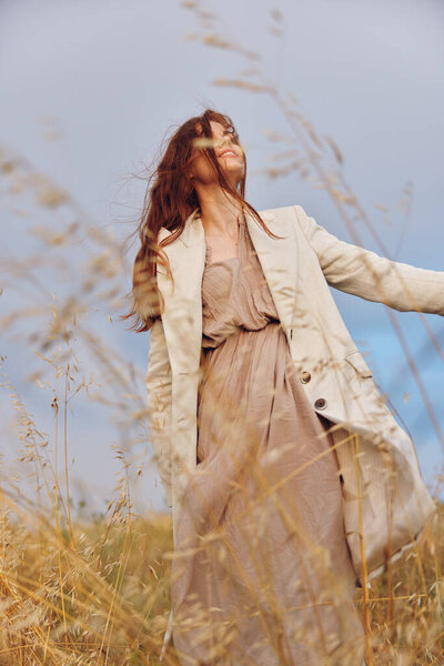 woman walk in the field autumn season concept