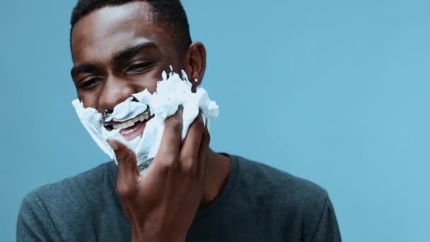 Man Shaves His Beard Razor Smiles Shaving Foam Close Blue — Stock Video