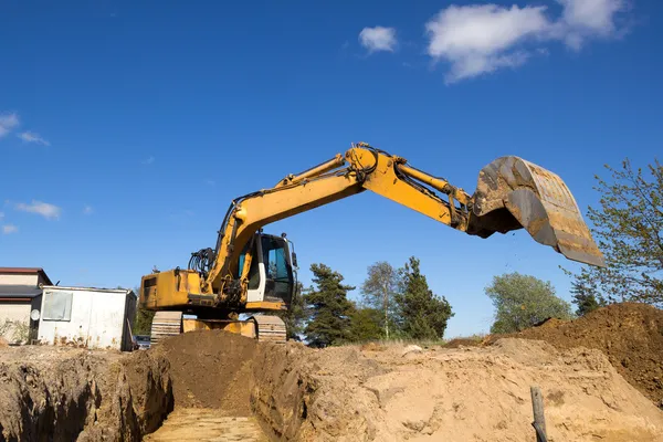 Excavator digging sewer trenche — Stock Photo, Image