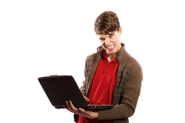 Сердитый мальчик смотрит на компьютер — стоковое фото