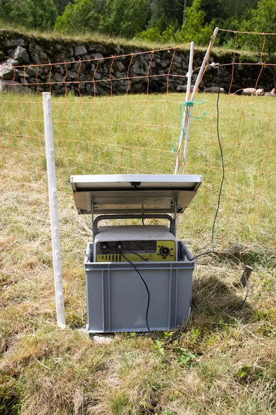 Solar energy panel with electric fence — Stock Photo, Image