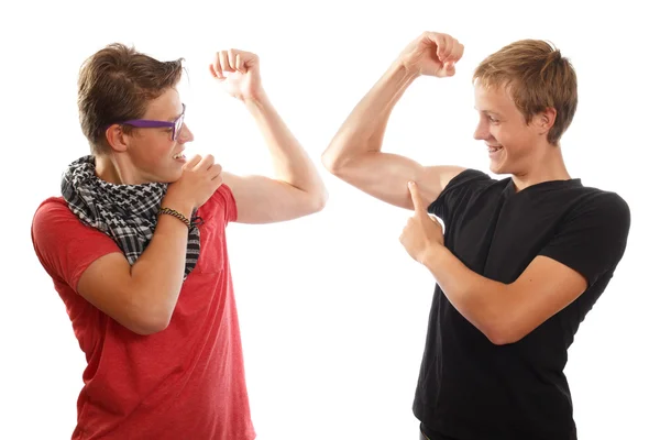 Boys showing off muscles — Stock Photo, Image