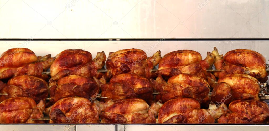 itinerant rotisserie with spit-roasted chickens