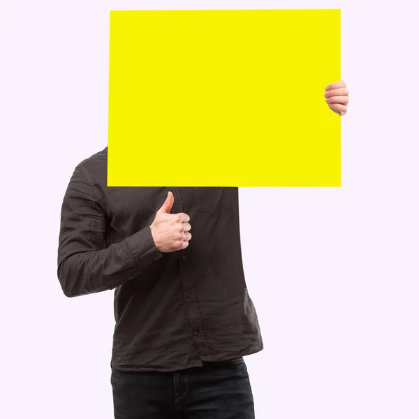Person Raises Yellow Sign Front Face — Stock Fotó