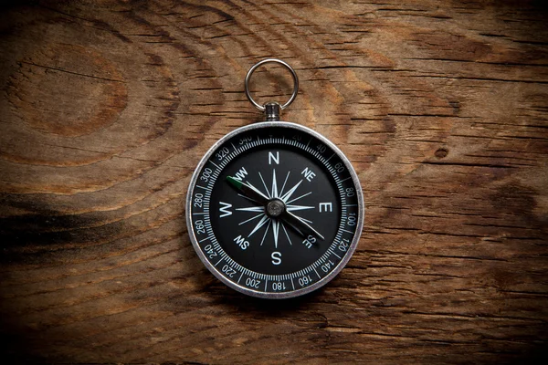 Compass on a wooden background — Stock Photo, Image