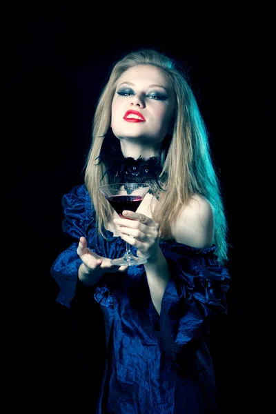 Aggressive vampire woman with glass — Stock Photo, Image