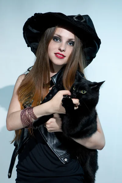 Beautiful witch with black cat — Stock Photo, Image