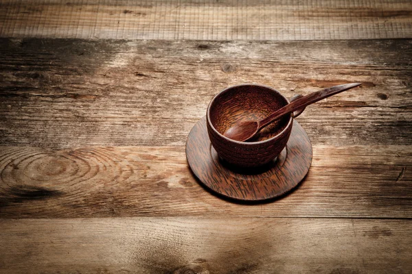 Wooden cup on old wooden table — Stock Photo, Image