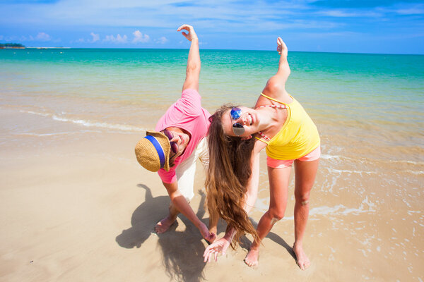 happy young couple having fun at tropical beach