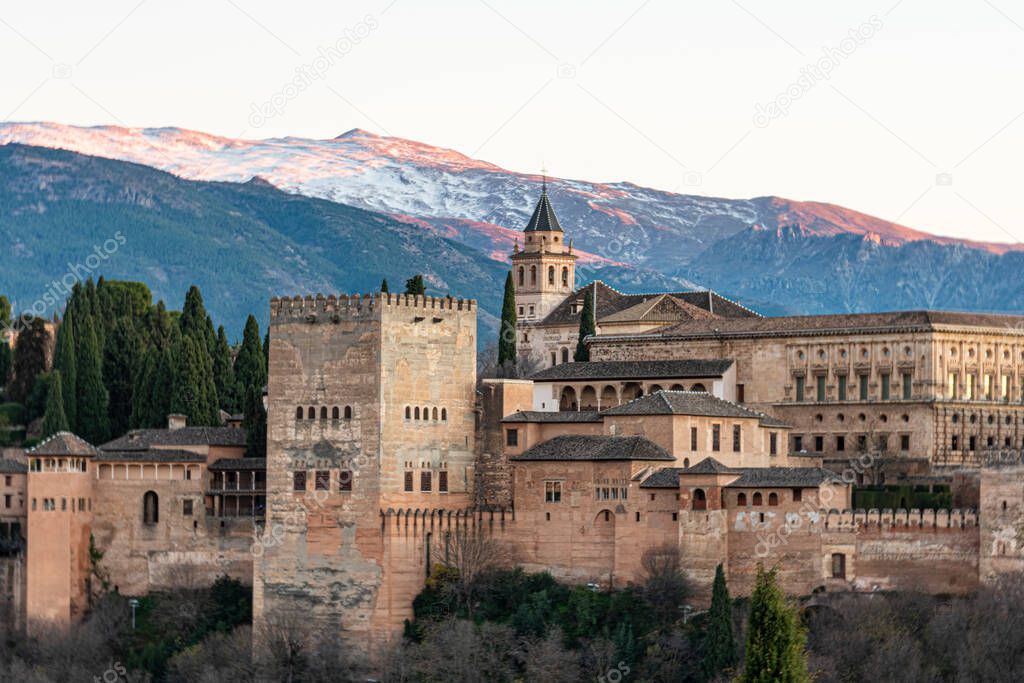 Partial view of the Alhambra Monumental Complex and the Sierra Nevada mountains in the background. Grenade. Andalusia. Spain.
