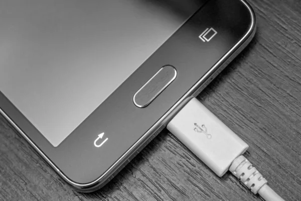 Phone Photos Charged White Wire Gray Background — Zdjęcie stockowe