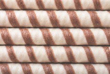 Wafer rolls bicolor background. An image of a flat lay texture.