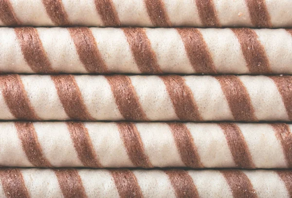 Wafer rolls bicolor background. An image of a flat lay texture.