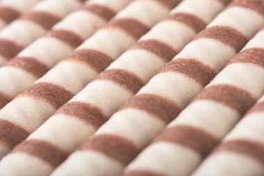 Delicious wafer sticks for tea as a background, top view. crunchy sweet food