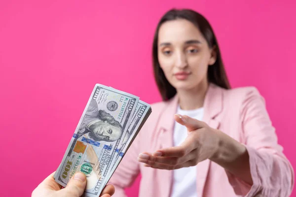 Woman Pink Jacket Receives Bribe Dollars Red Background — Stock Photo, Image